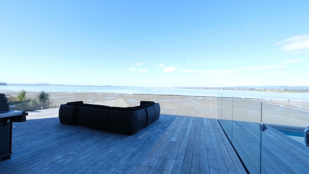 Modern barn-style home with large glass facade