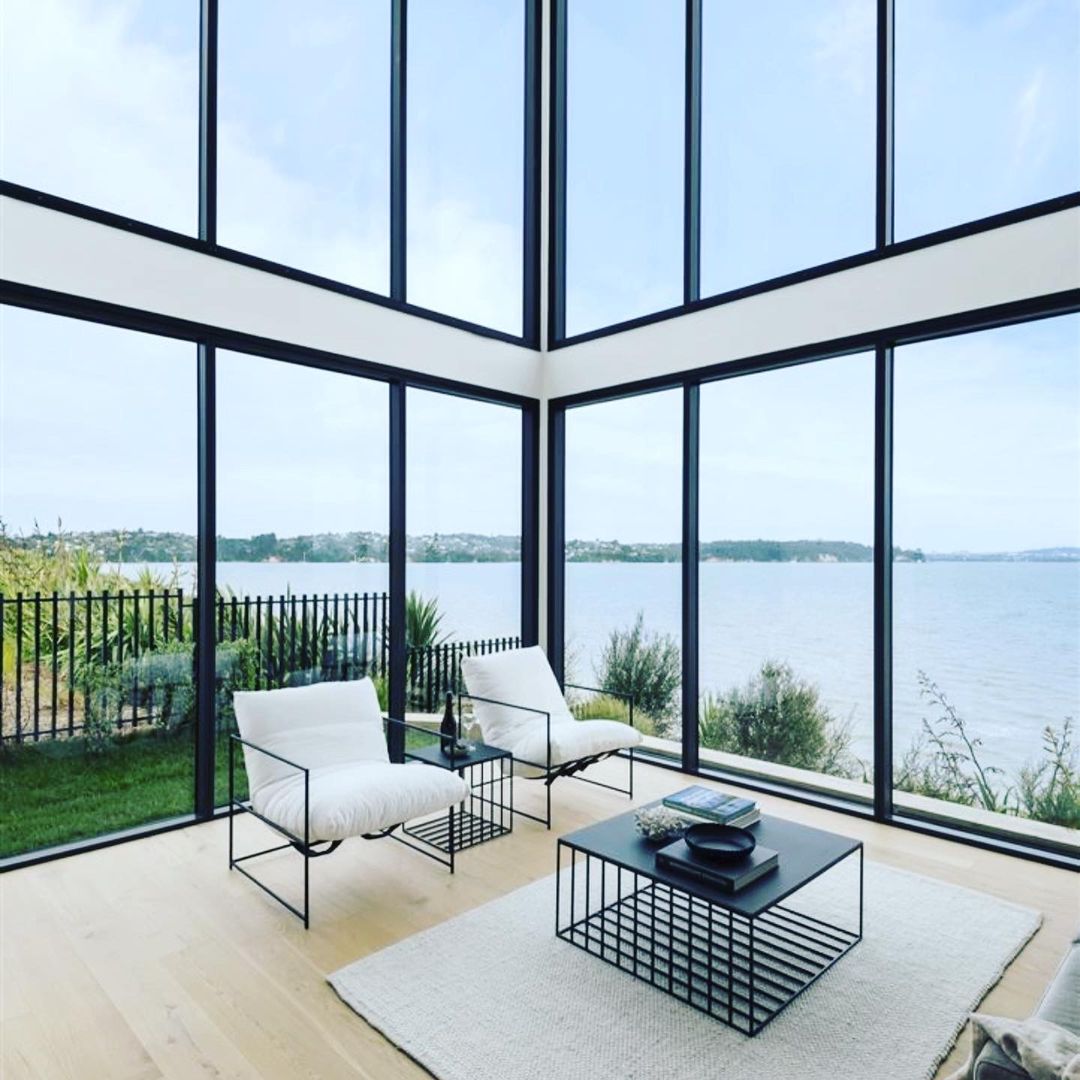 Modern luxury home with pool at dusk